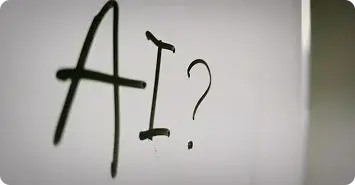 A whiteboard with AI? written on it